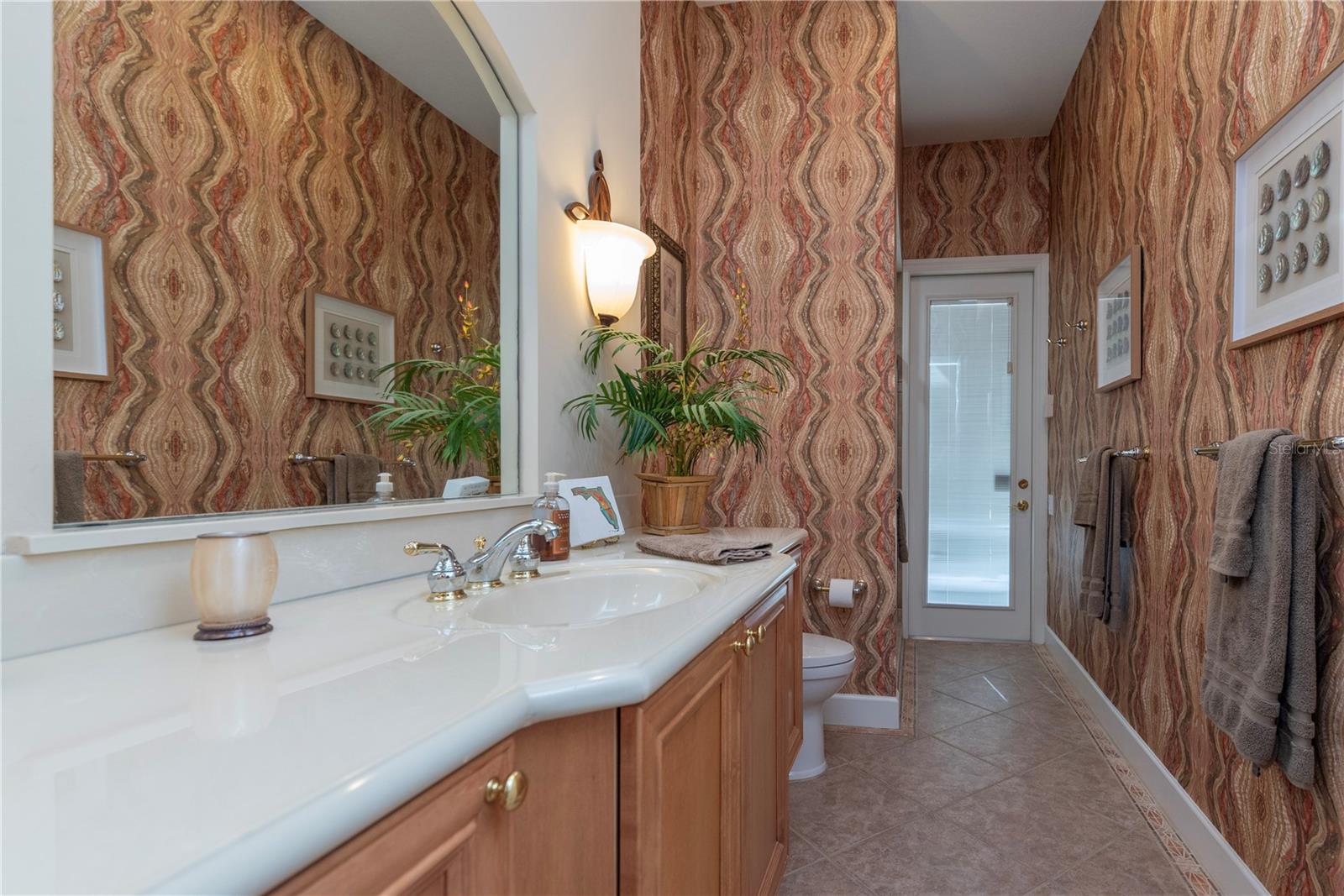Guest bathroom 4 is a pool bath that’s adjacent to the office.