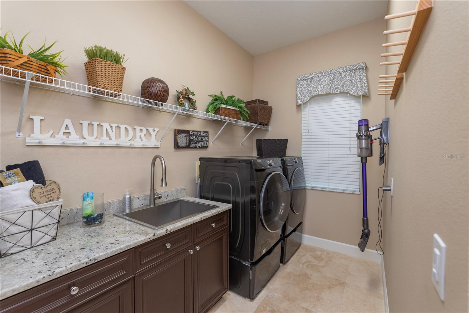 Laundry room with utility sink.