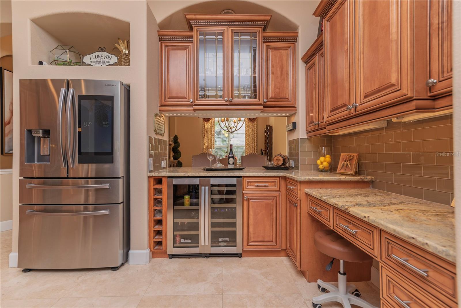 Wine refrigerator and stainless steel appliances.