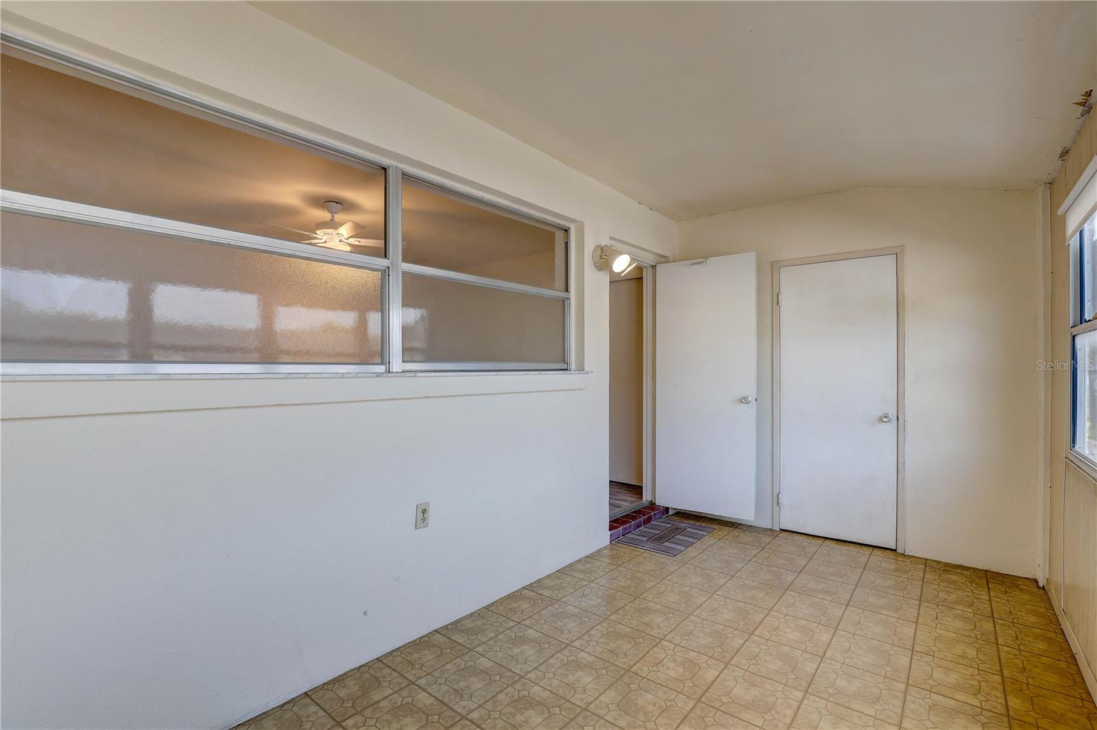 Florida room with a storage closet