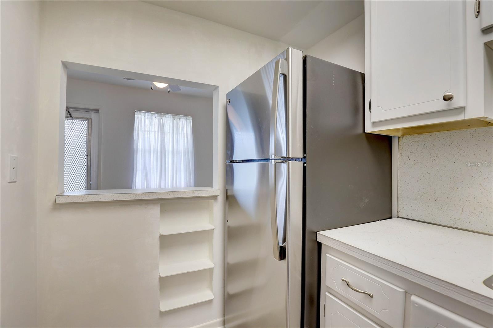 Kitchen with ass thru to the dining room