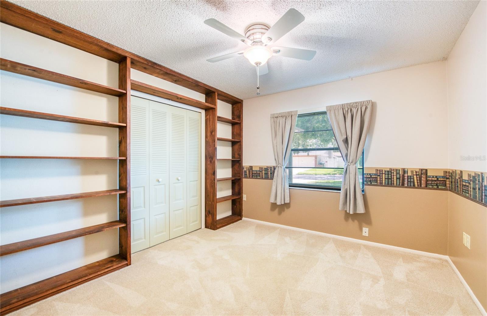 Bedroom 3 with built in book shelves