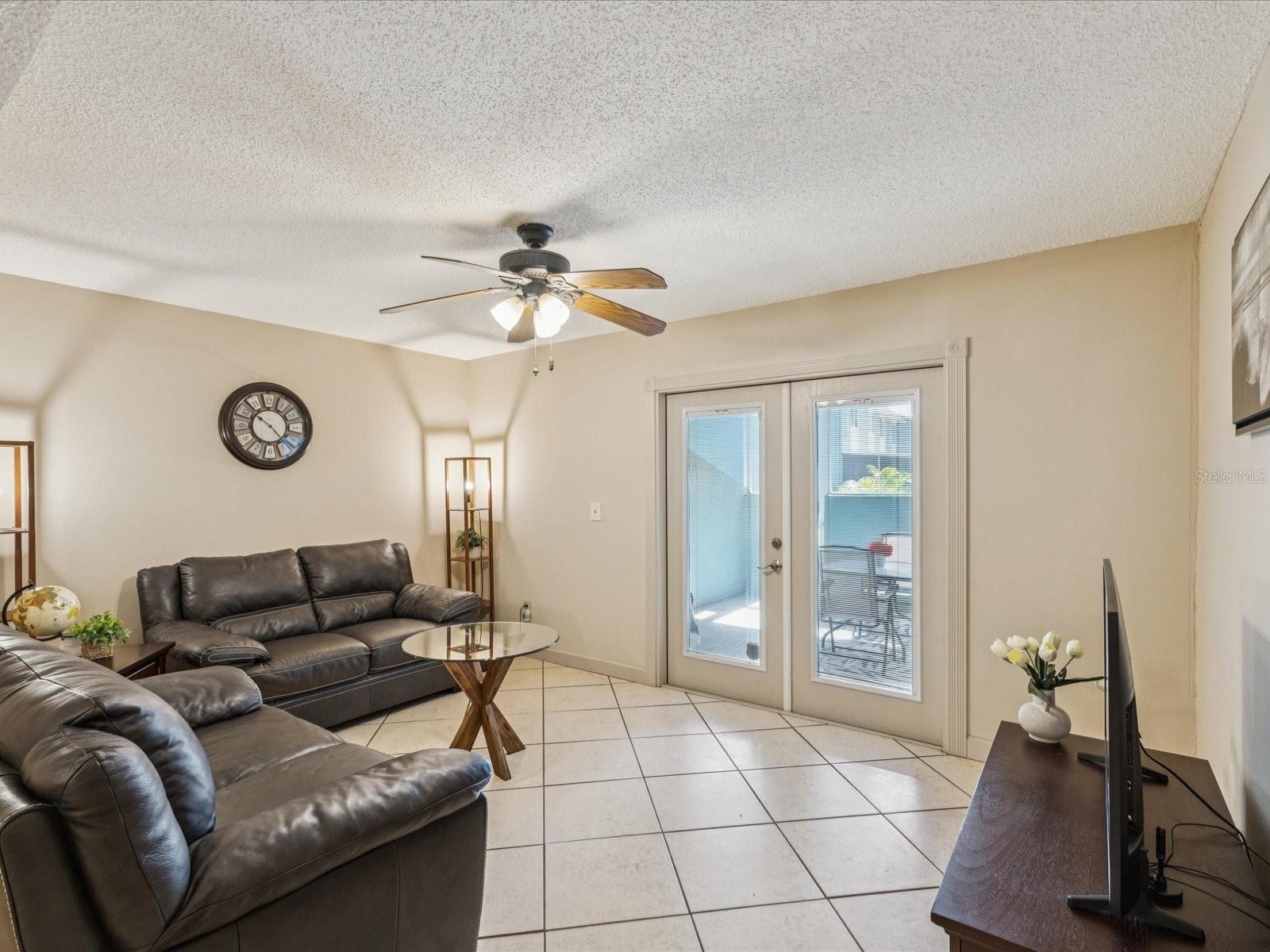 Main Floor Living room with french doors leading to Screened Porch