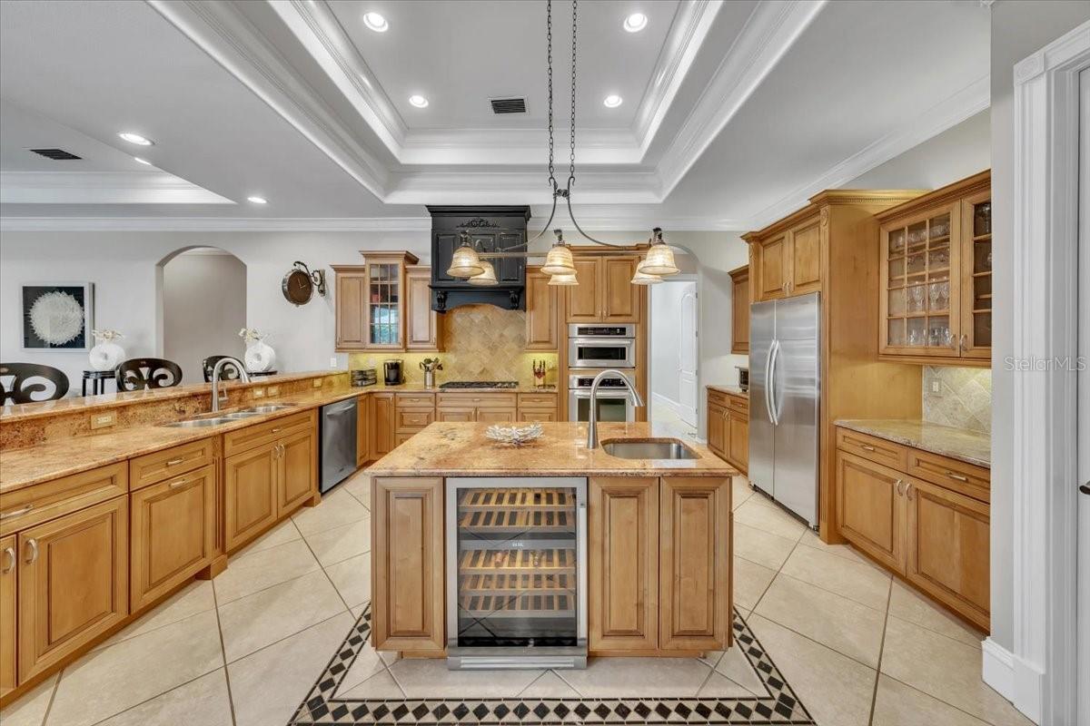 A chef’s dream with double ovens, wine fridge, and ample prep space!