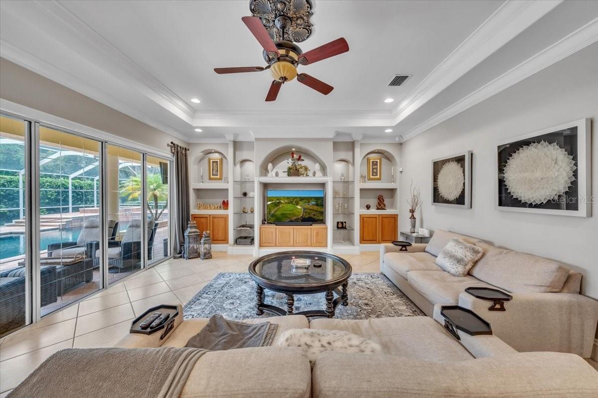 Custom built-ins, surround sound, and crown molding bring comfort and style!