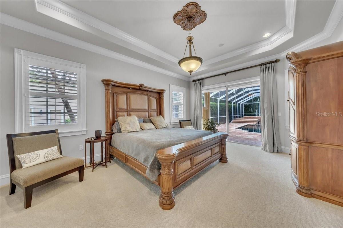 A true owner’s retreat with tray ceiling, lanai access, and dual California closets!