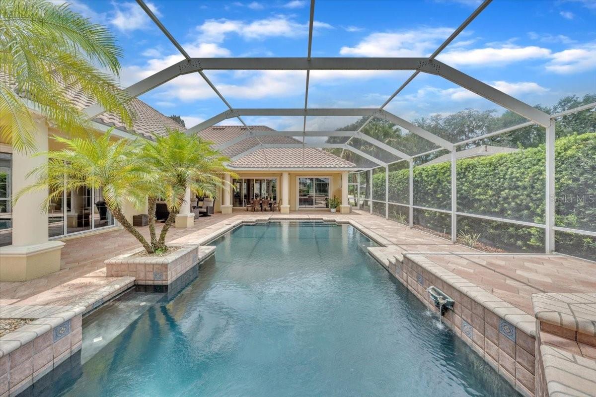 Multi-level pavered lanai surrounded by greenery for total privacy!