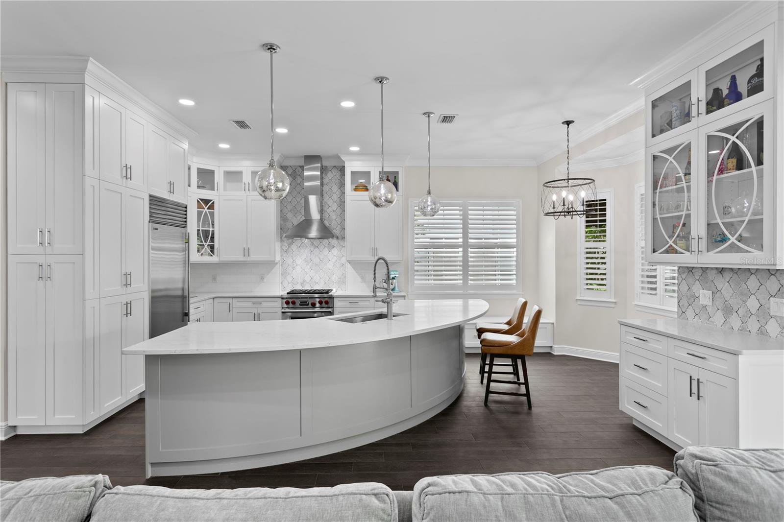 The spacious center island invites everyone to gather around—whether for meals, conversation, or entertaining.