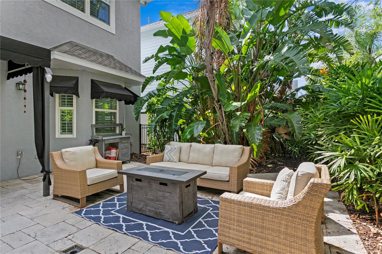 You can enjoy the shade provided by the awning, with plenty of space for a grill and outdoor seating.