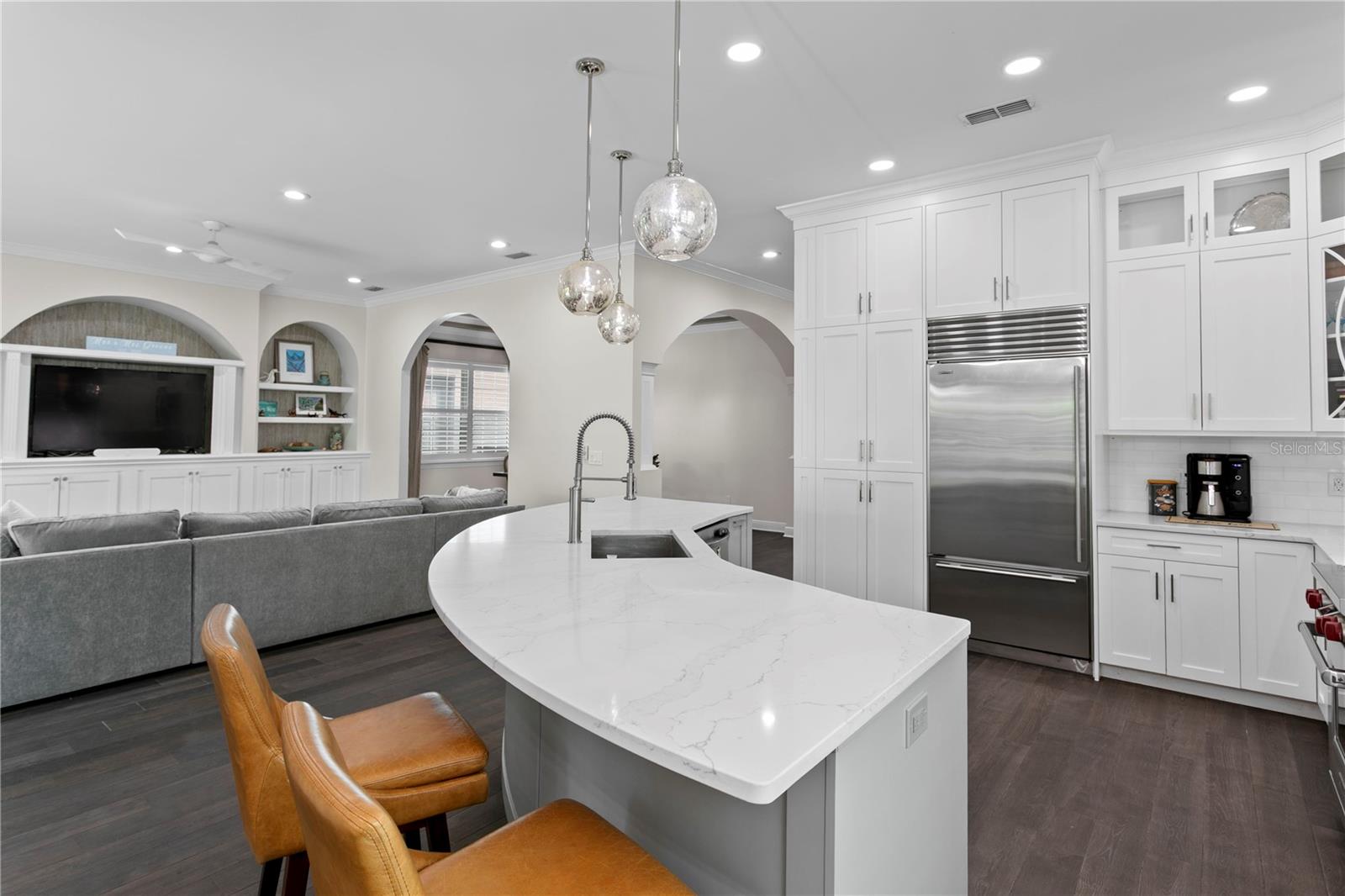 The open floor plan keeps you connected, allowing you to be part of the conversation while in the kitchen, even as others relax in the family room.