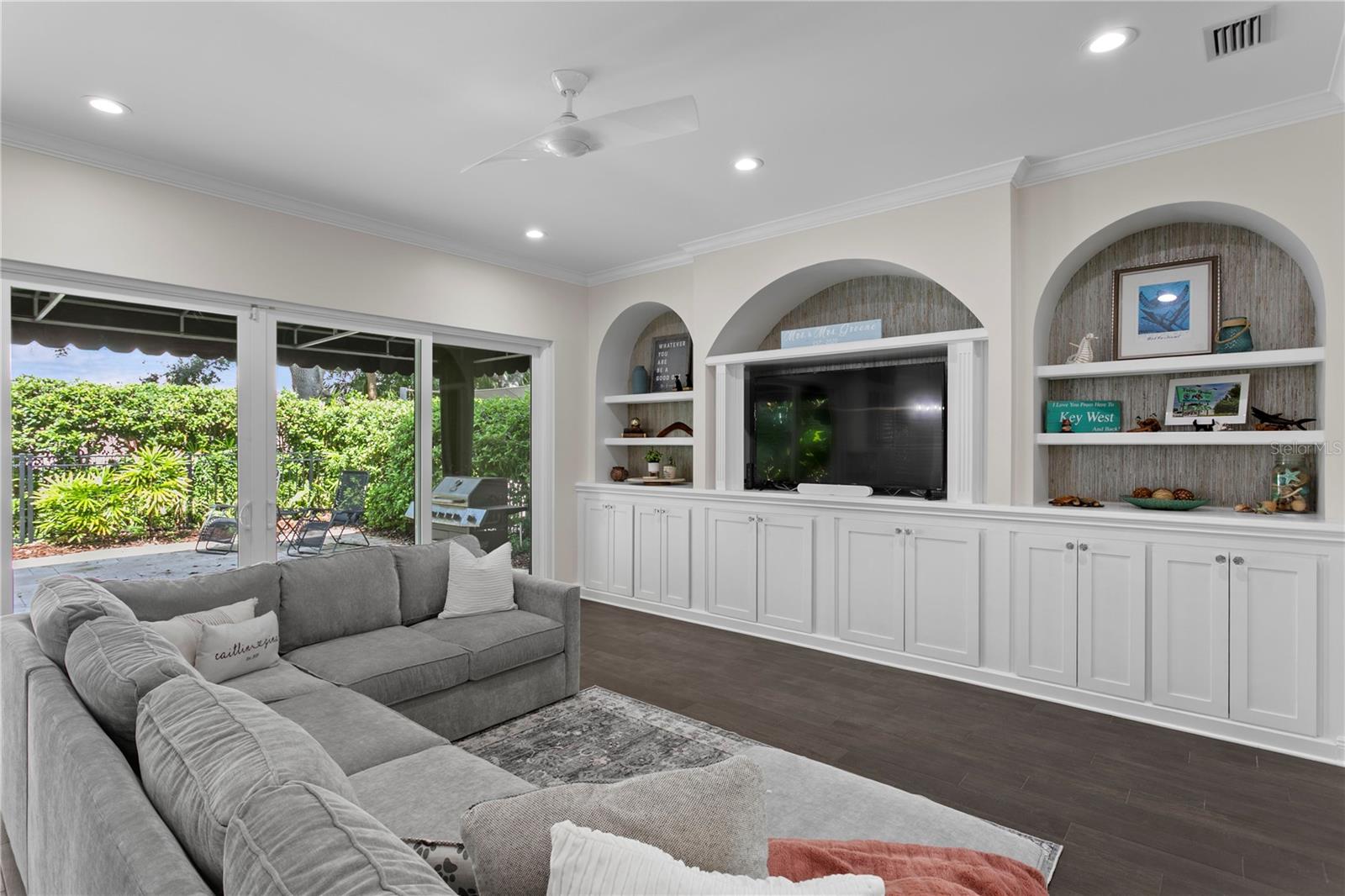 Stylish built-ins offer convenient storage for toys and other everyday items, keeping the space tidy and organized.