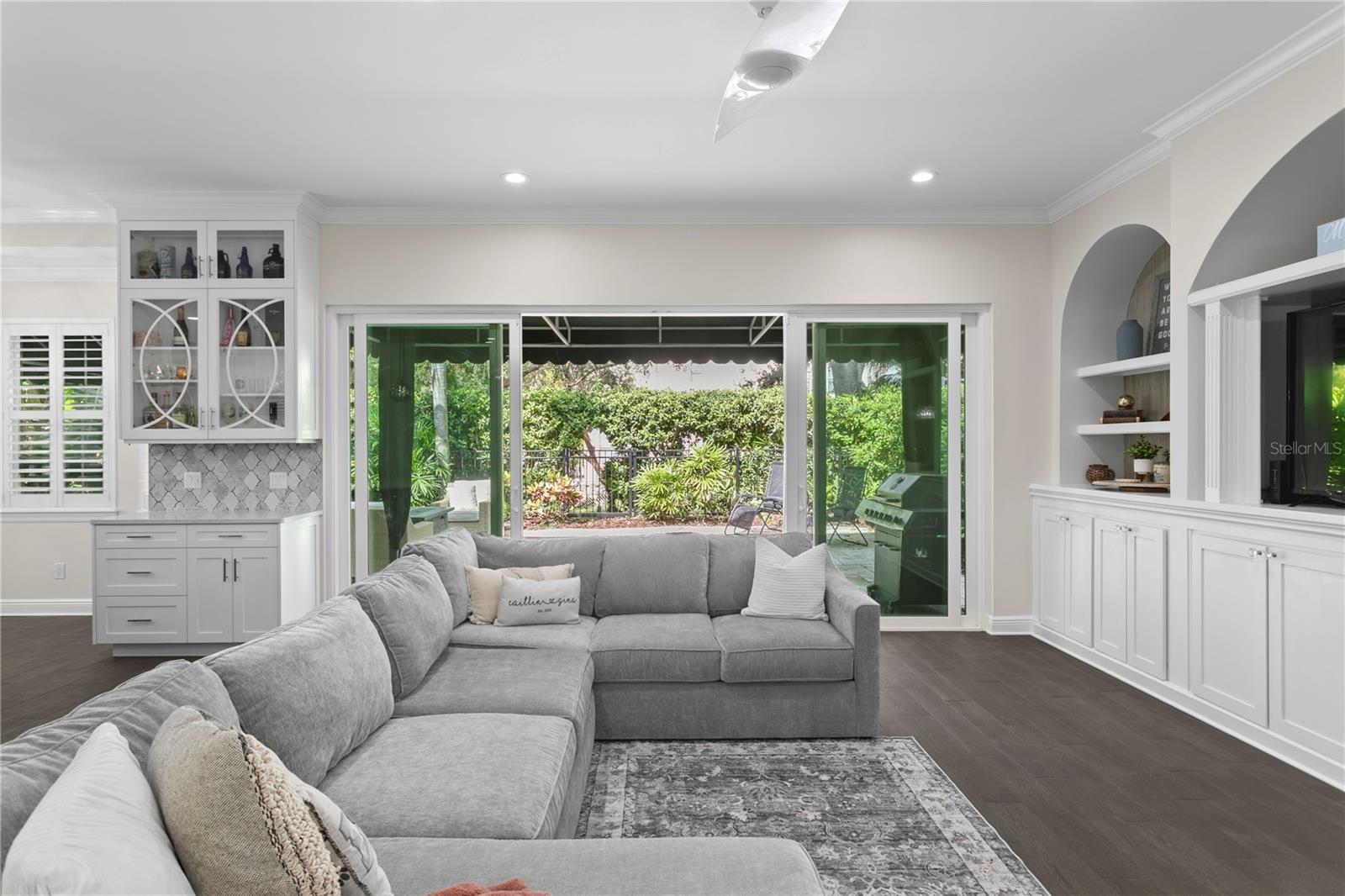 Keep the impact-rated sliders open on cooler nights to enjoy seamless indoor-outdoor living