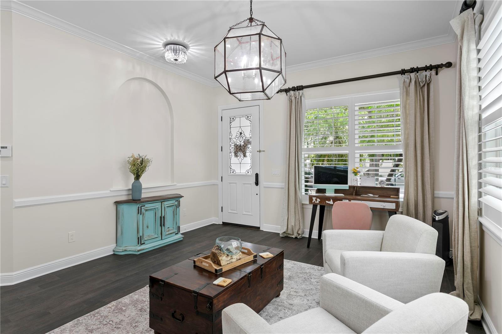 The front room offers flexible space—perfect for additional seating, a home office, or whatever suits your lifestyle.