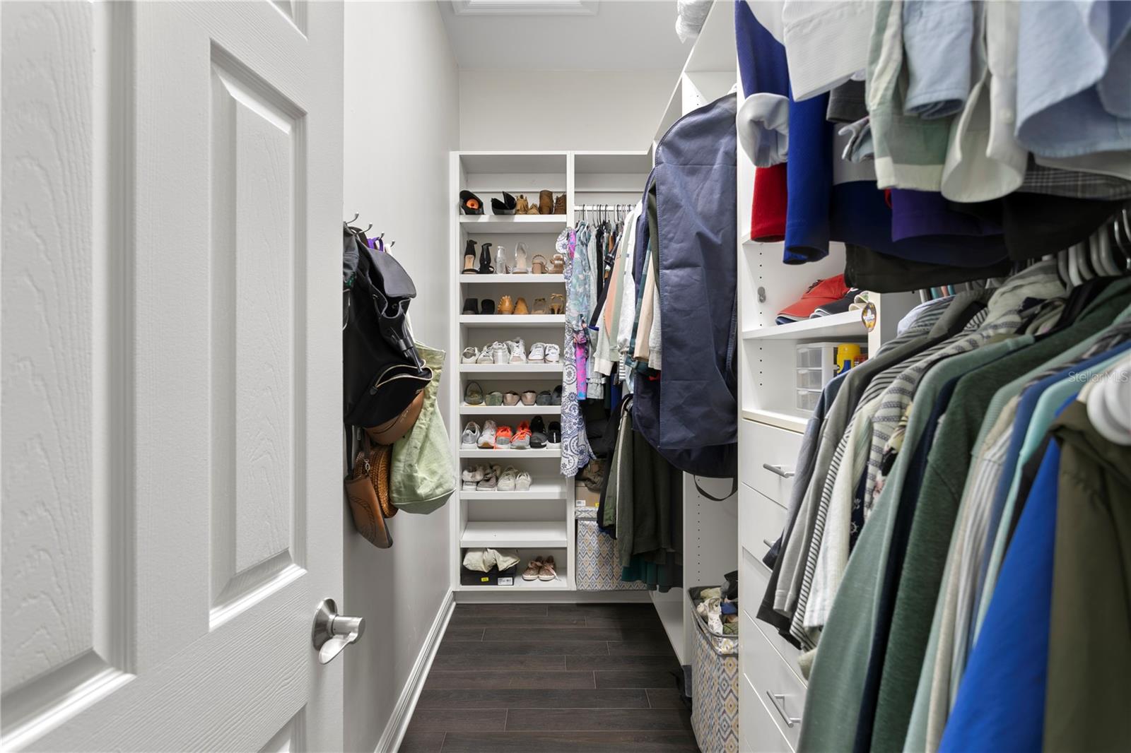 Enjoy a spacious walk-in closet with plenty of room for organized storage and wardrobe needs