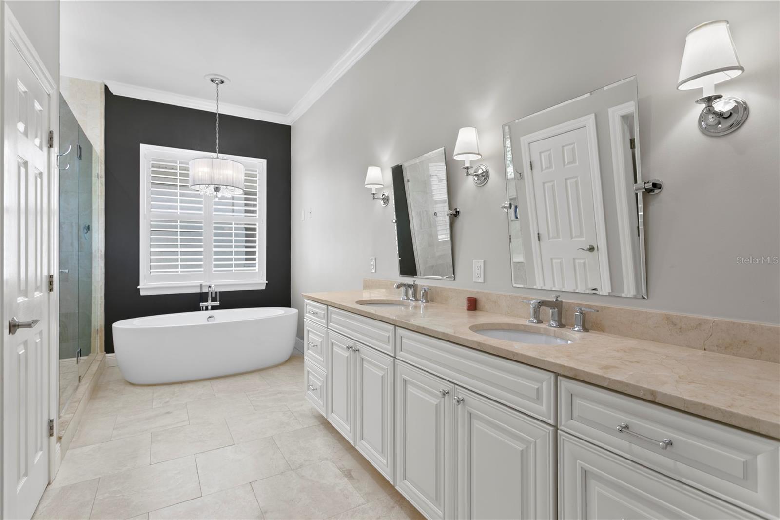 GORGEOUS MARBLE master bath offering an OVERSIZED walk-in shower, separate SOAKING tub, and dual vanities