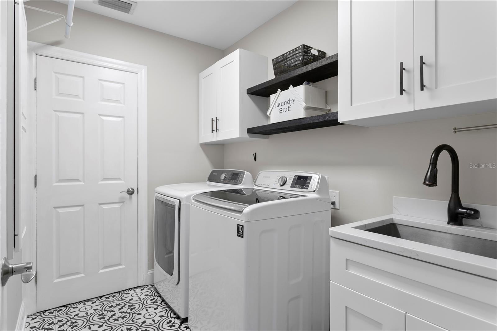 Located upstairs close to all bedrooms, the laundry room simplifies laundry tasks and includes a sink for handwashing.