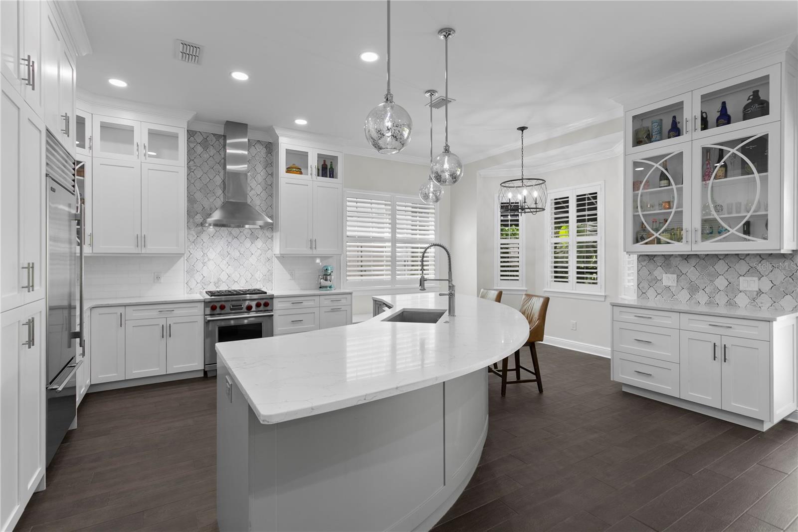 The chef’s delight kitchen was renovated to create a large center island, loads of storage, WOLFE gas range and oven, SUBZERO Refrigerator, and separate wine bar with WINE refrigerator.