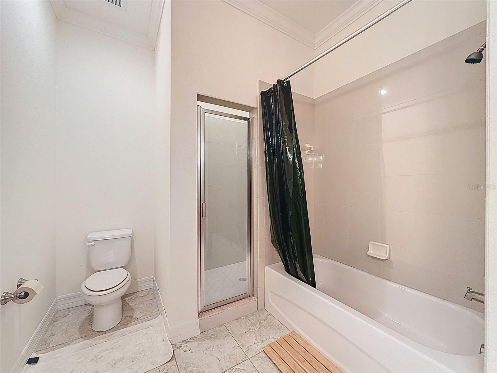 Primary Bath features a shower and separate tub