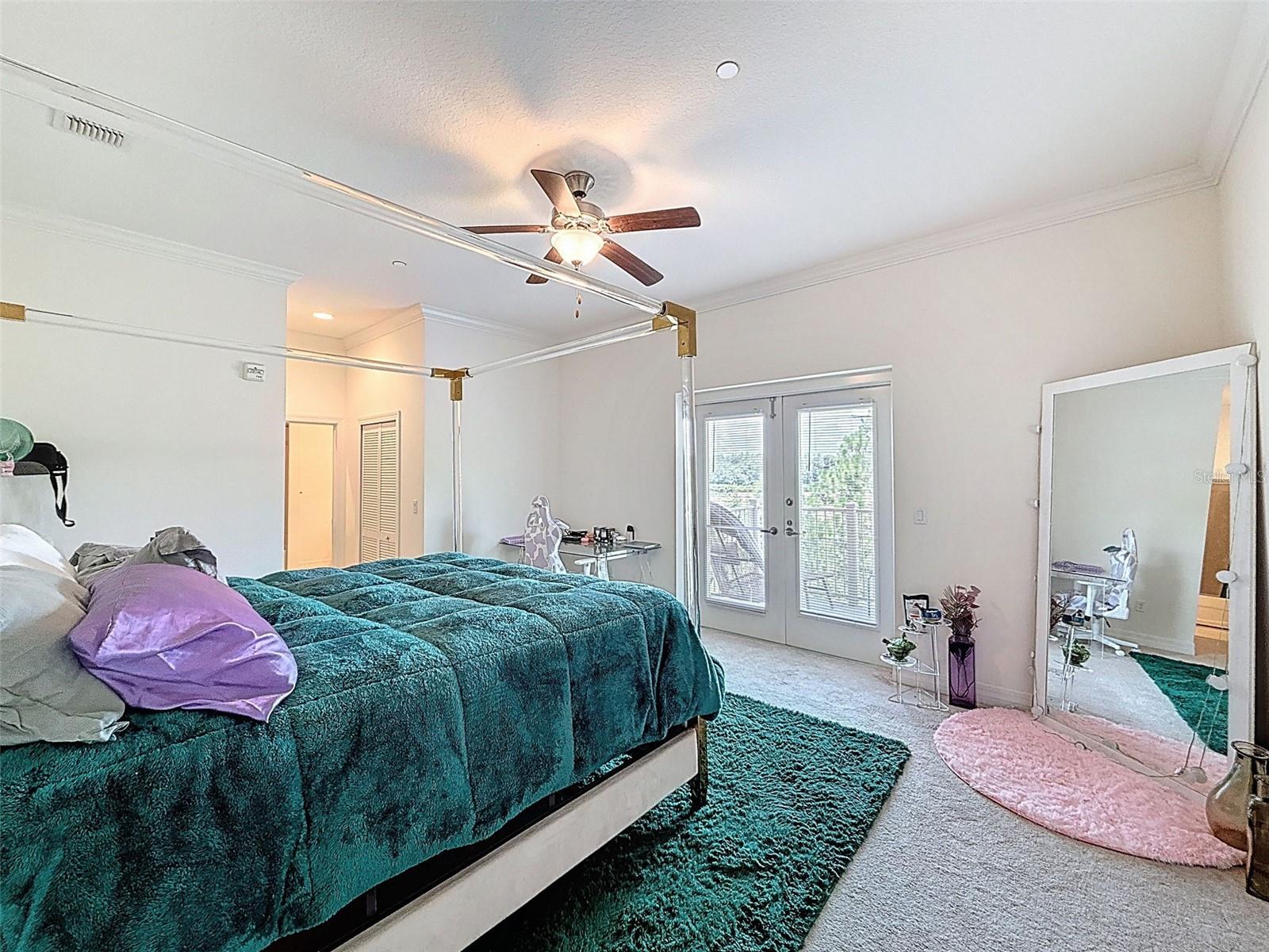 Primary Bedroom - Doors lead out to the private balcony