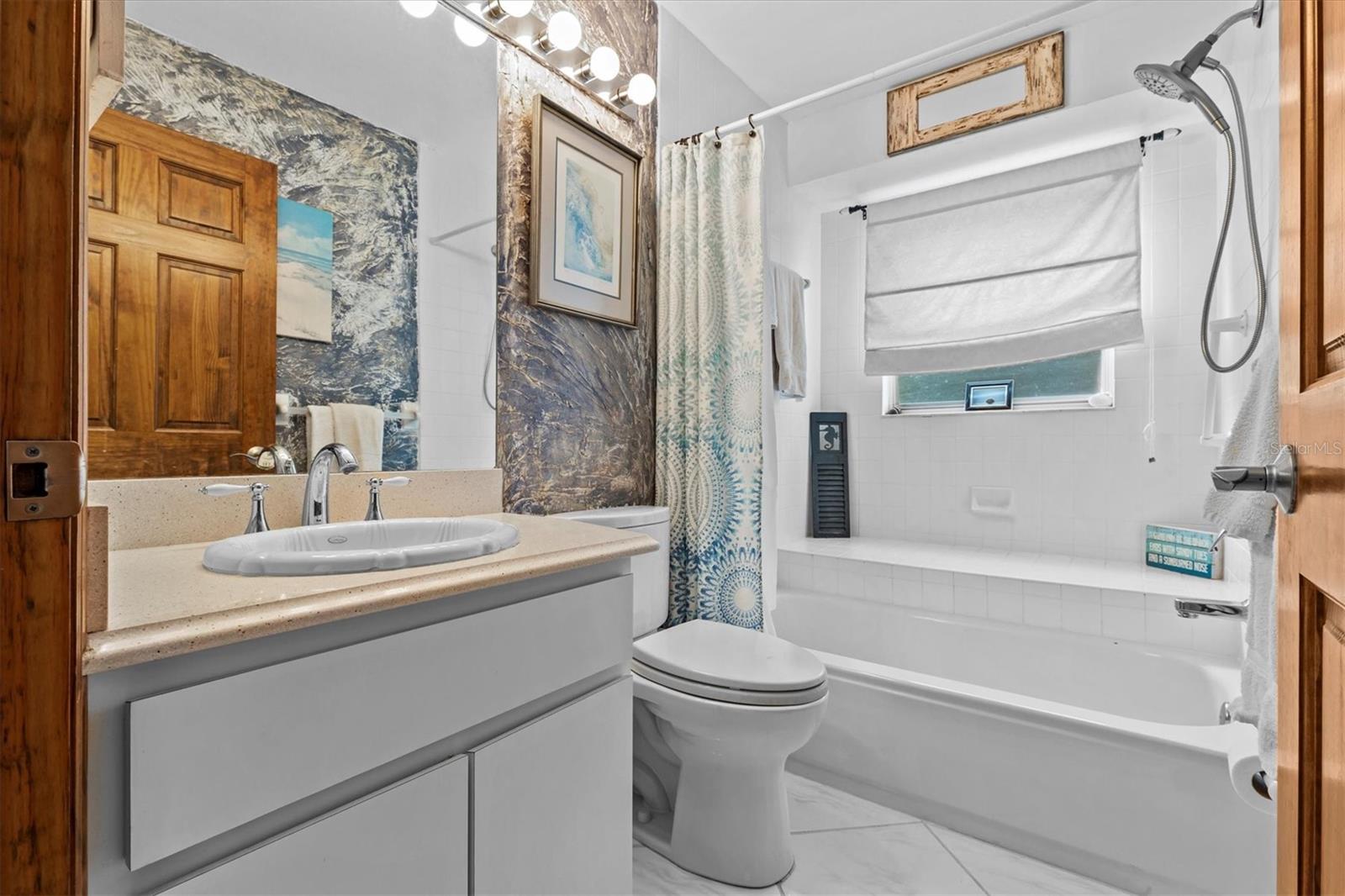 Hall bathroom by the 2 bedrooms off the kitchen.