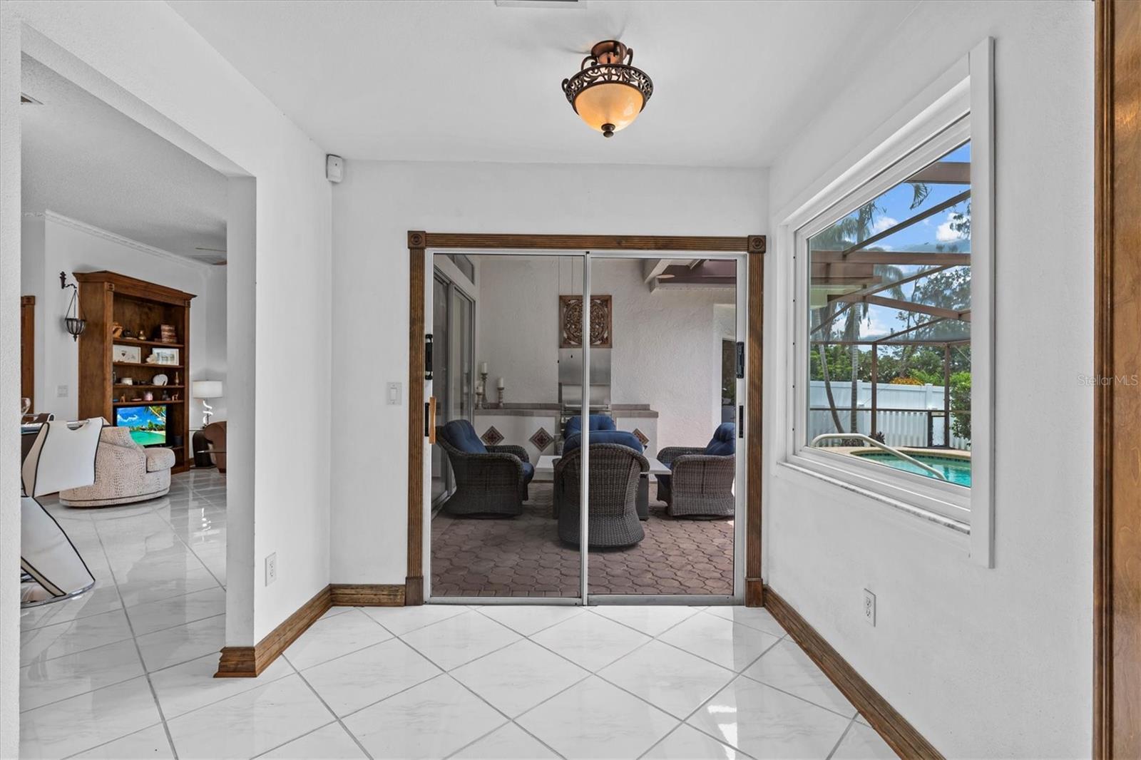 Eat in area off the kitchen leading to the pool.