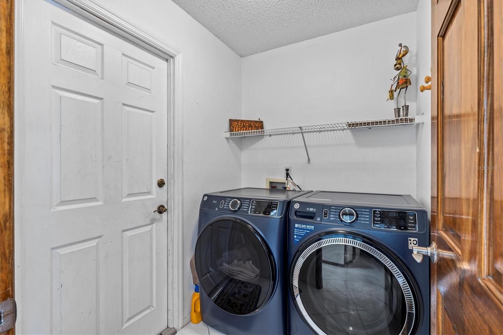 Laundry room leading to the garage area.