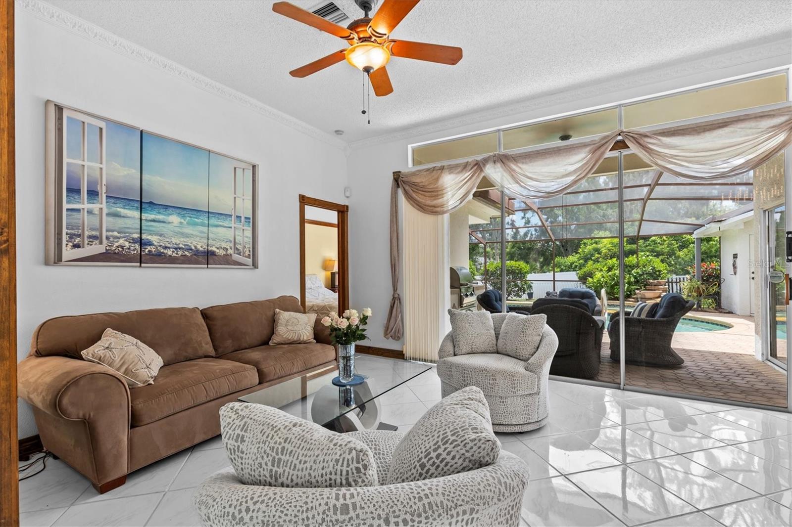 From the front entry way you see the screened pool/spa area leading to your private backyard.