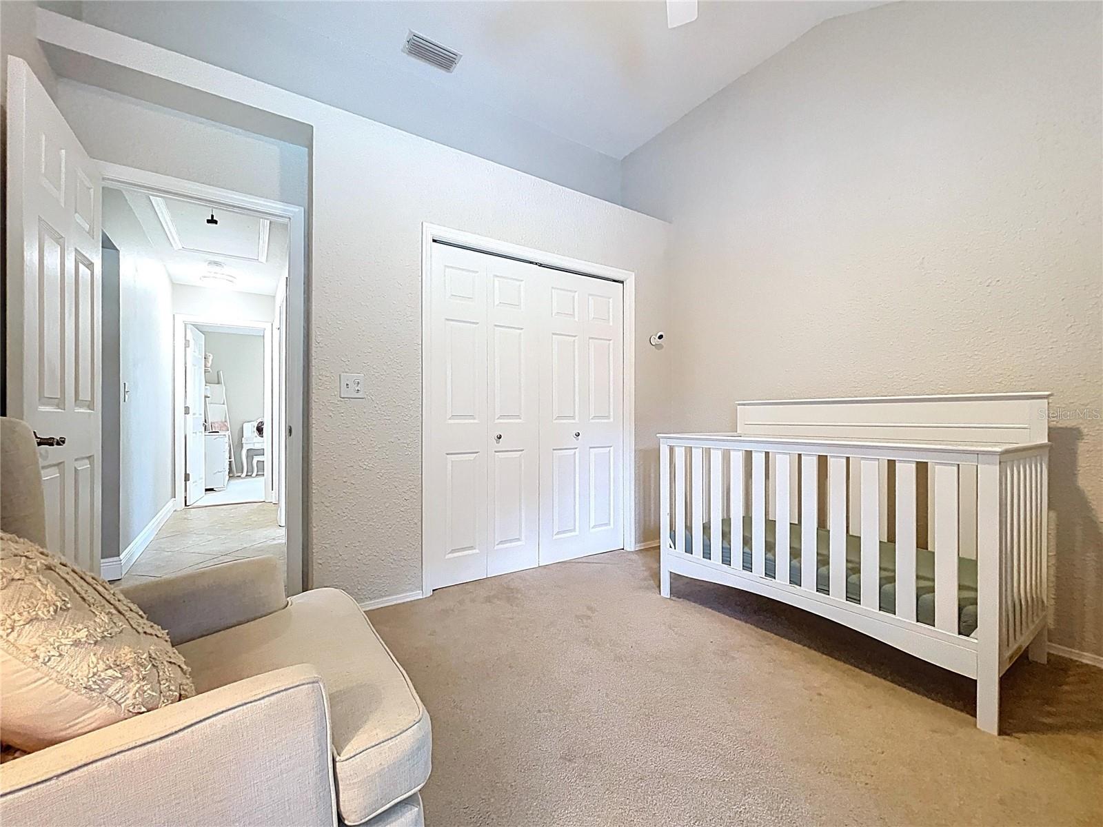 Spacious layout with double-door closet and calming tones, ideal for use as a guest suite, office, or playroom.