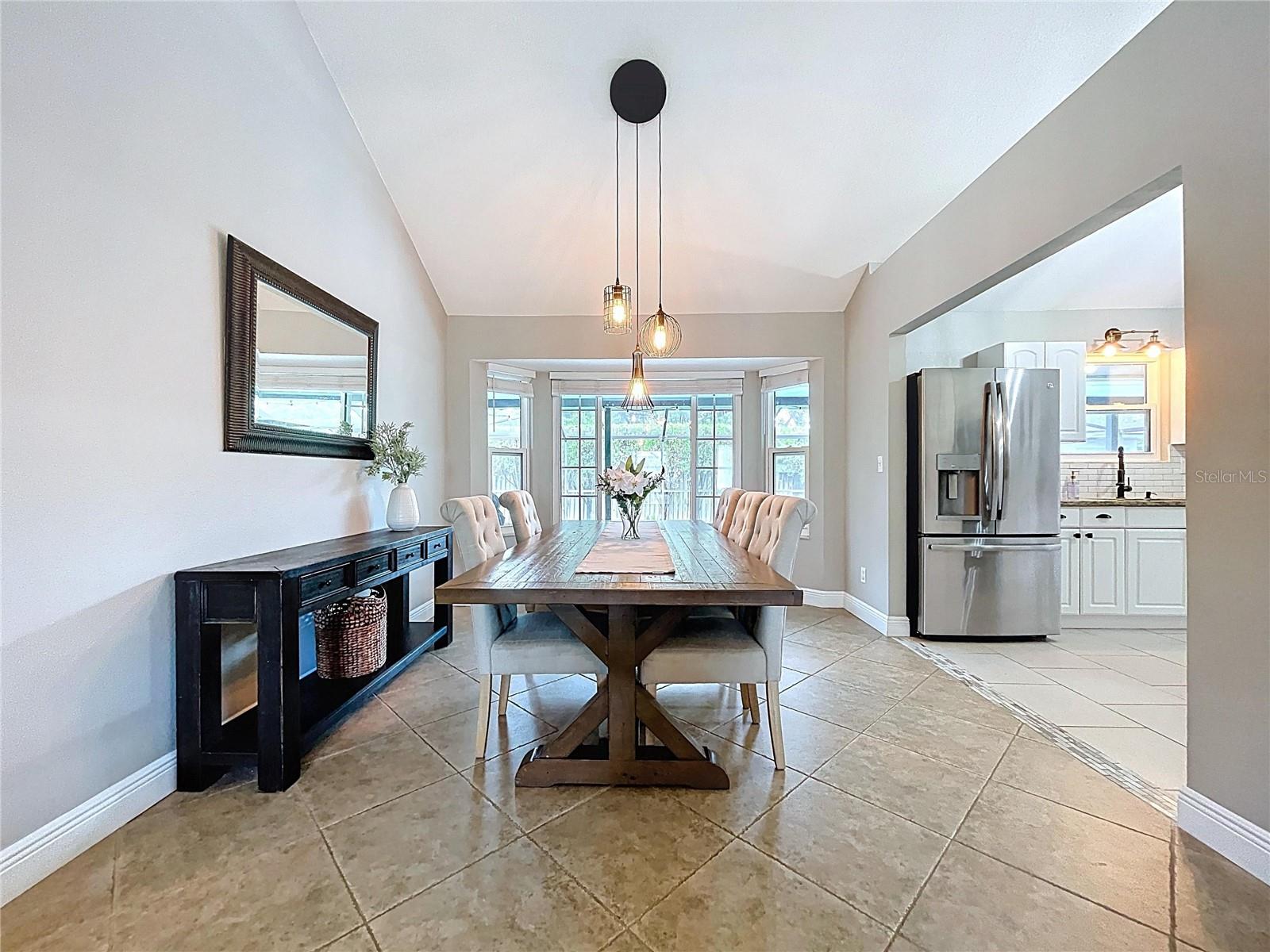 Bright and airy dining space highlighted by a charming bay window overlooking the backyard, bringing in beautiful natural light throughout the day.