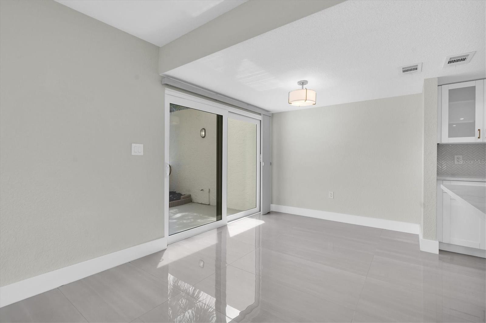 Impact sliders leading to private patio off the dining room