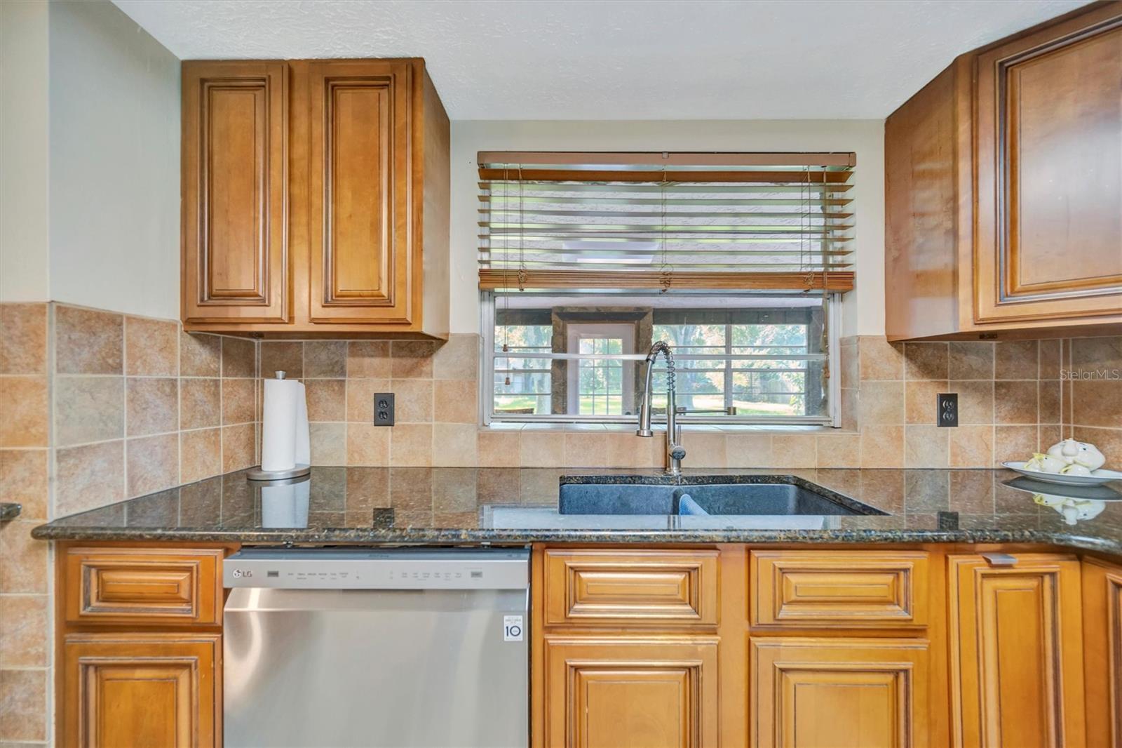 Enjoy scenic backyard views from the kitchen sink