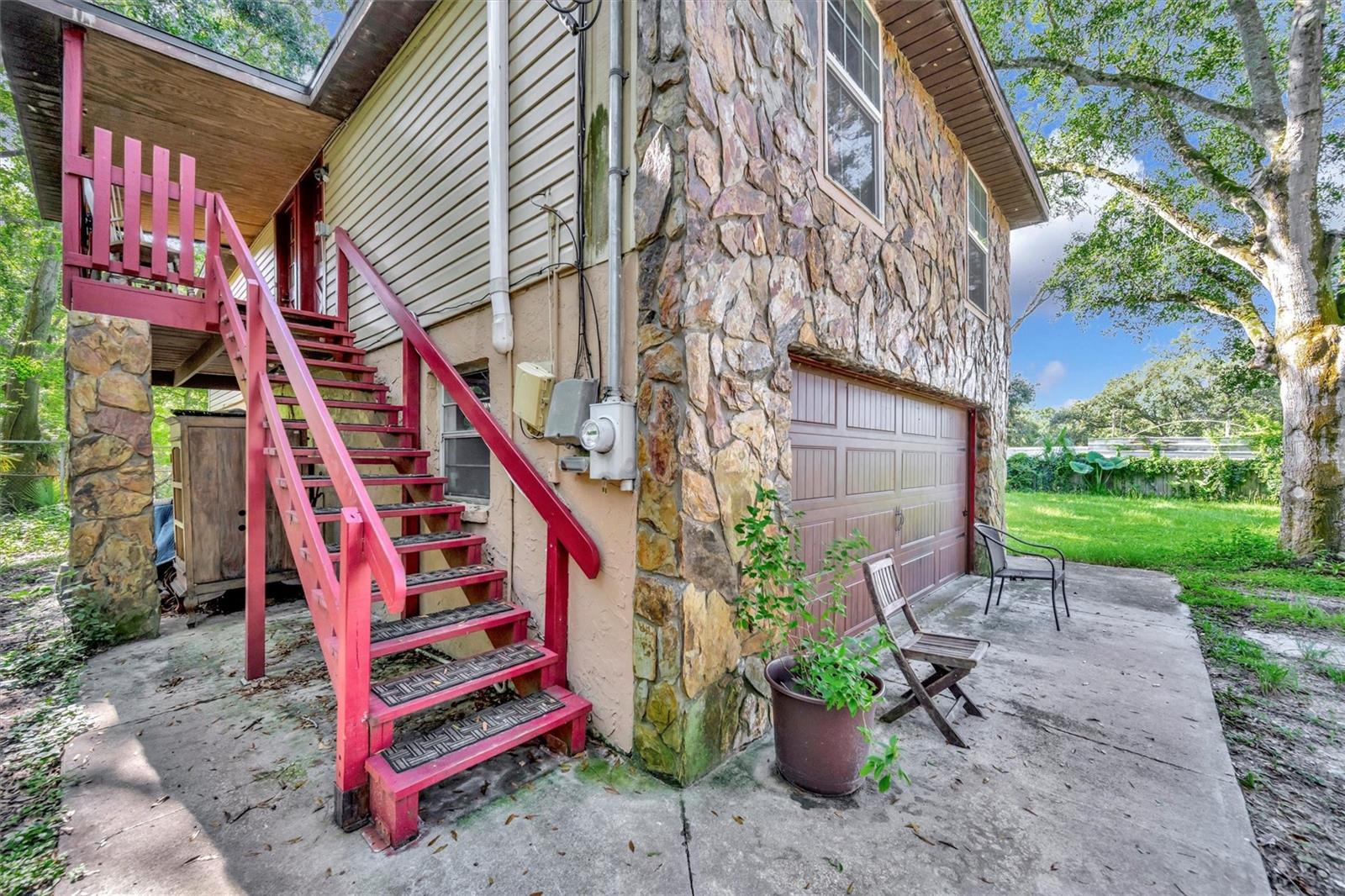 Detached ADU adjoins the 2-car garage serving the main house