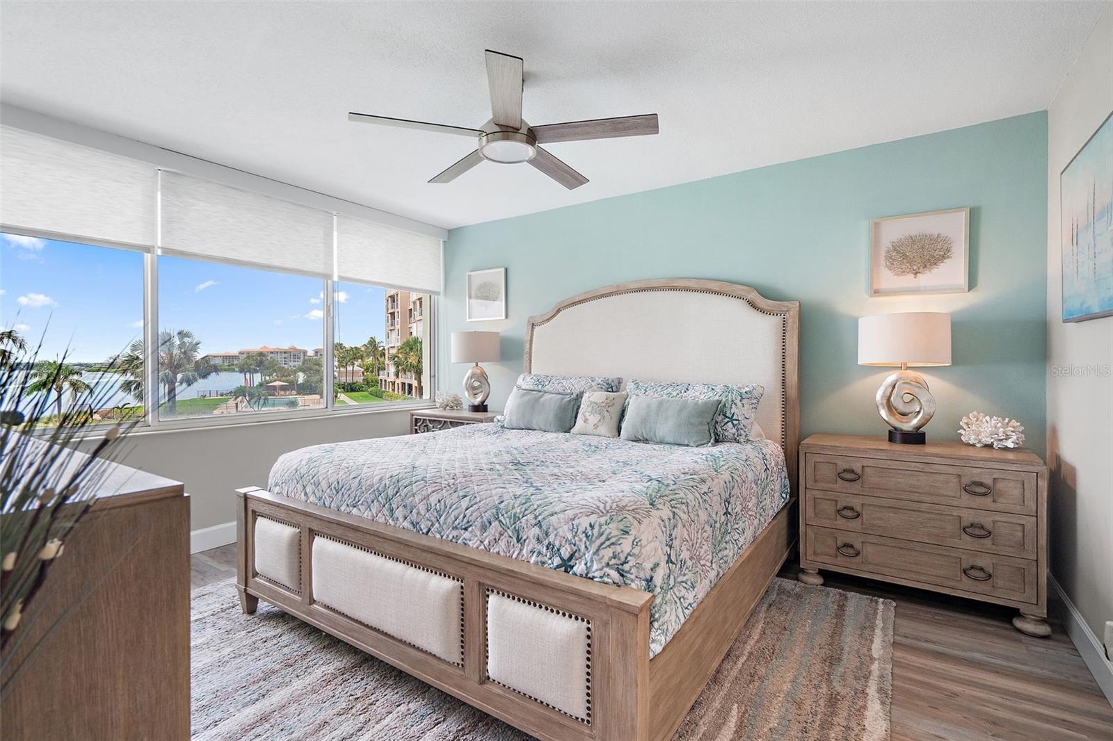 Primary Bedroom with a water view