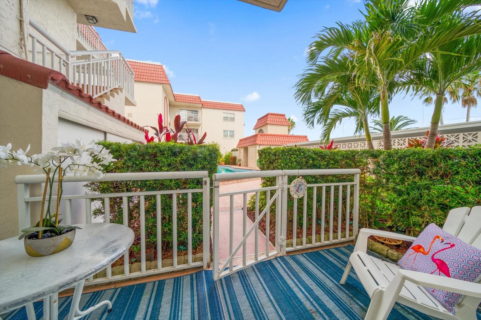Large Covered Patio with easy access to the pool & beach