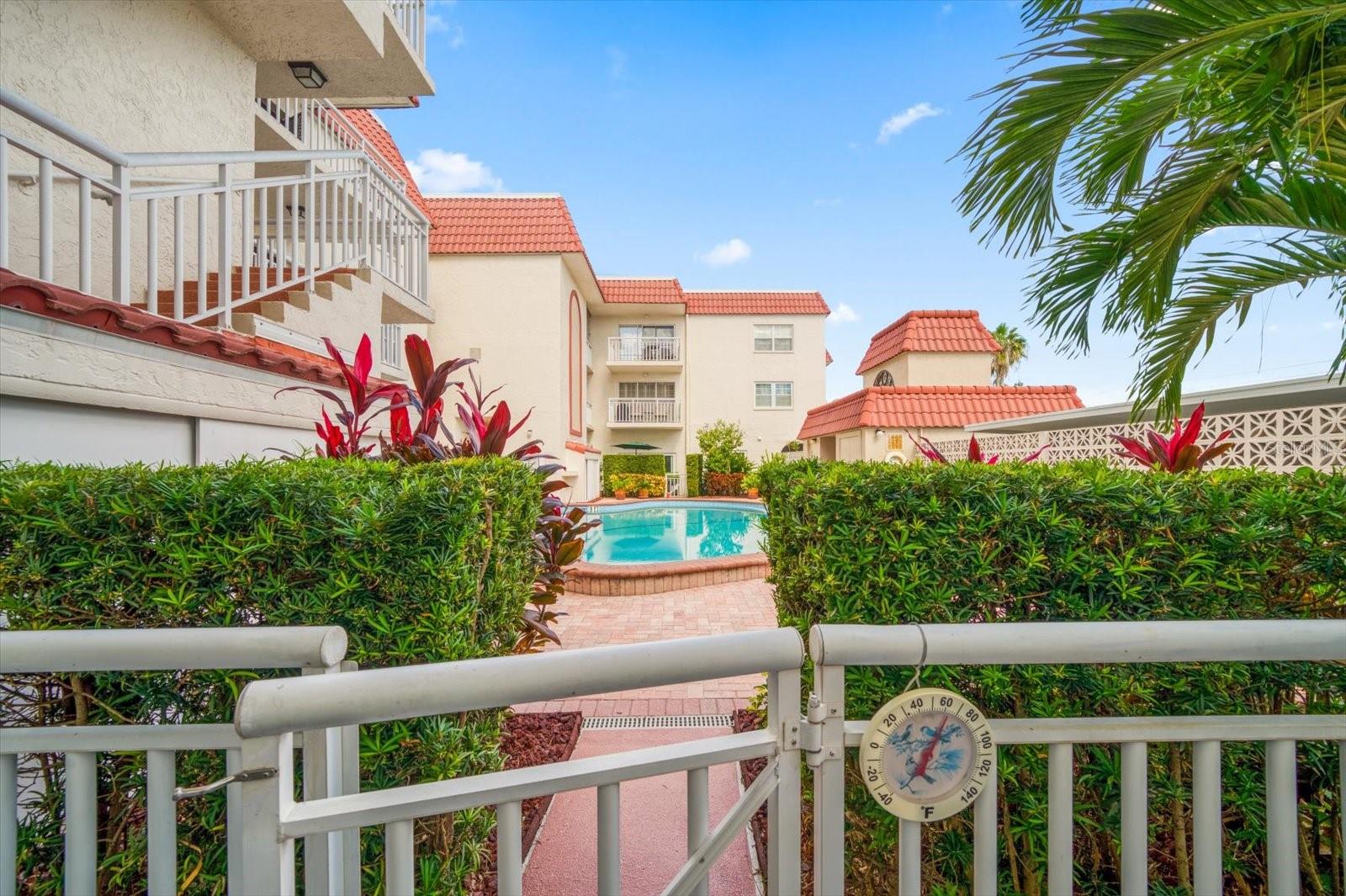 Large covered patio with direct access to community pool