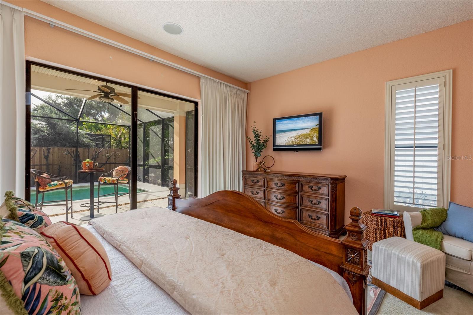 Primary Bedroom with black-out Curtains and Sliders to the Pool/Spa
