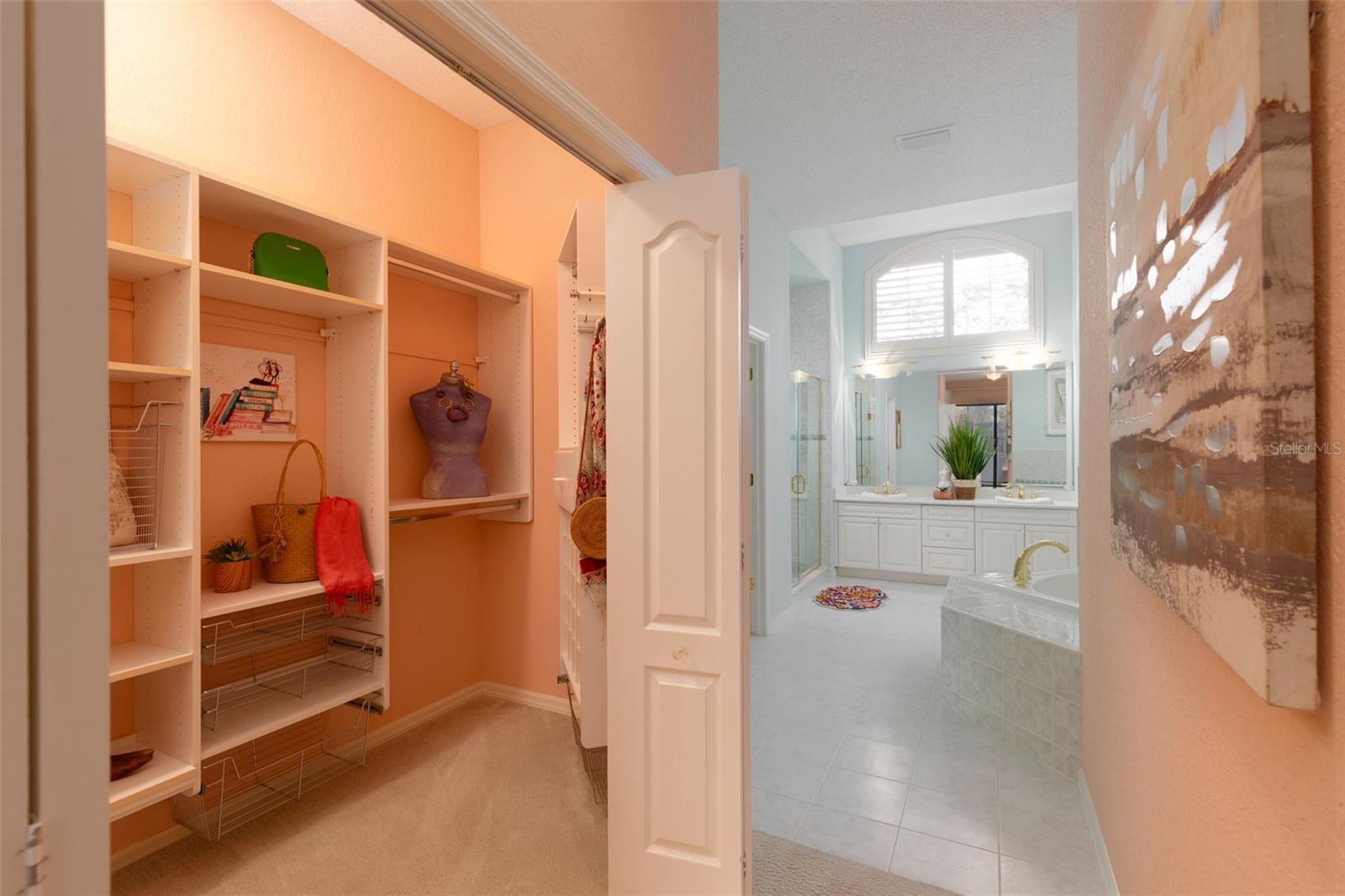 Primary Bedroom Walk-In Closet into En-Suite Bathroom