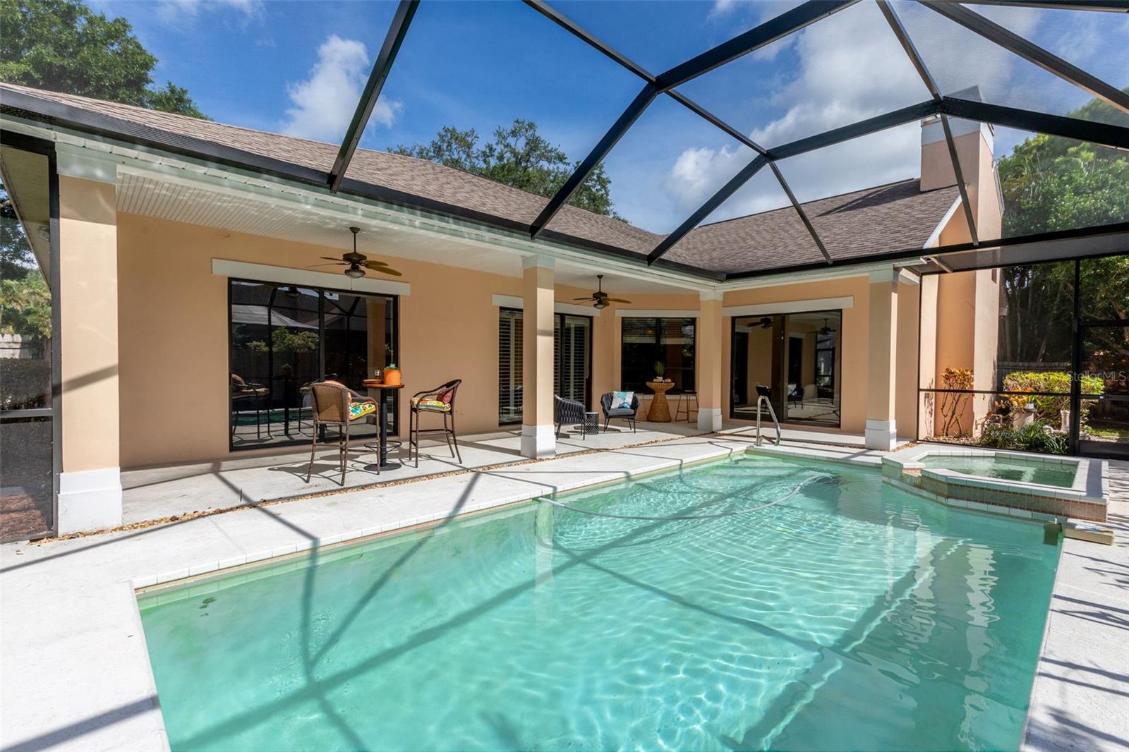 Pool/Spa with 3 sets of Sliders into the Home