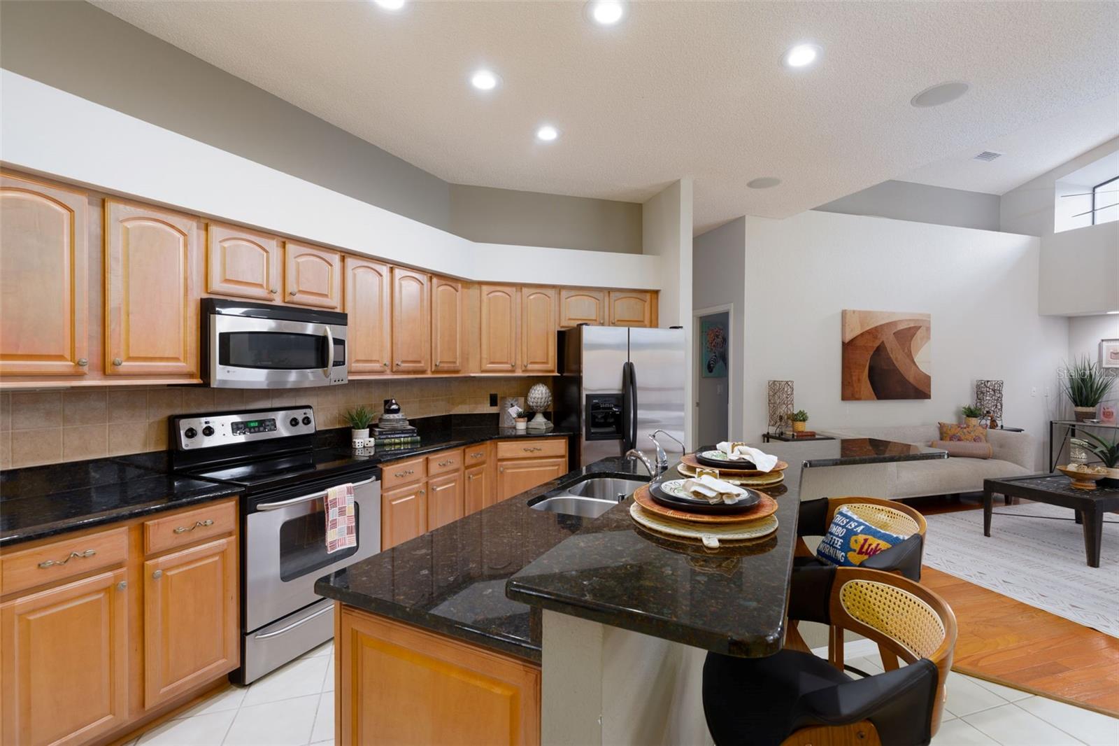 Kitchen with Breakfast Bar looking into Family Room
