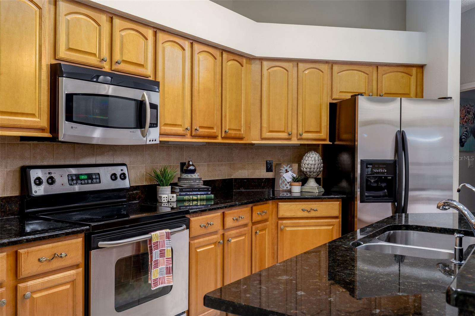 Kitchen with granite counter tops and stainless steel appliances