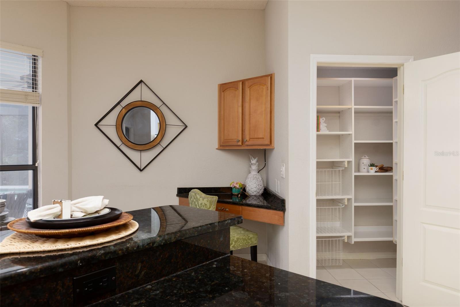 Built-In Desk and large Walk-In Pantry in Kitchen