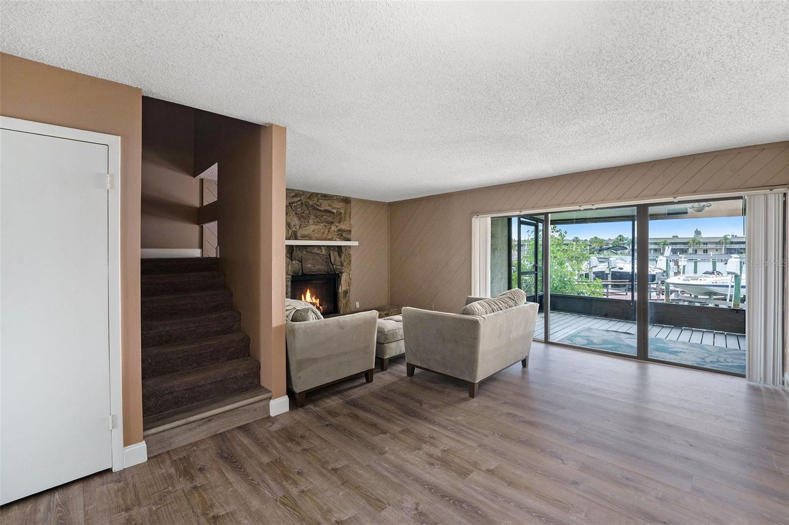 From dining room to living area. Door is to under stair storage.