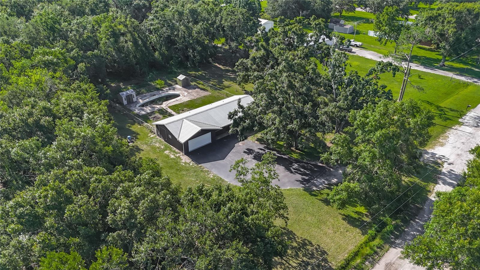 In-ground pool behind home