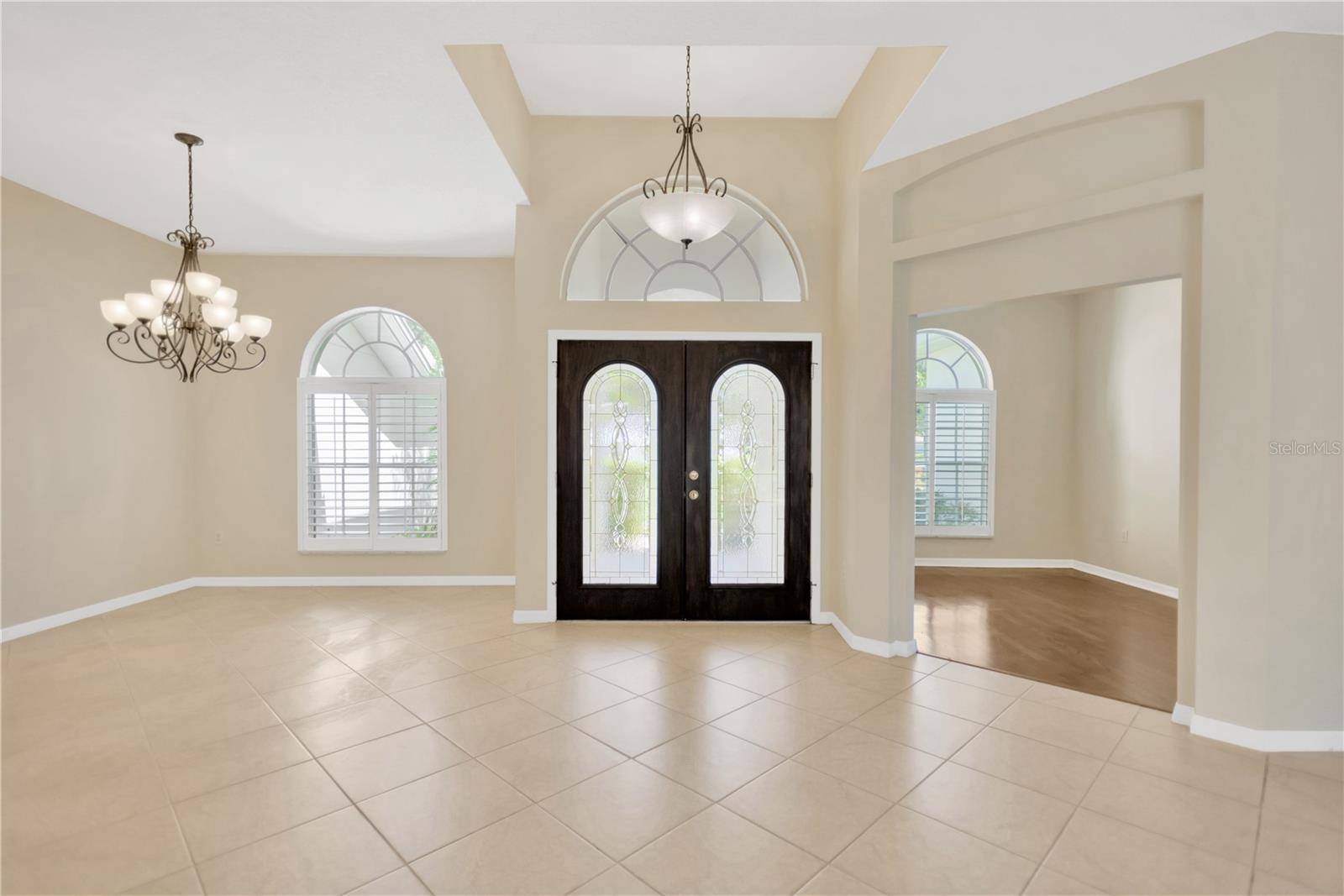 Greet your guests in the foyer with formal dining on one side and home office or den on the other.