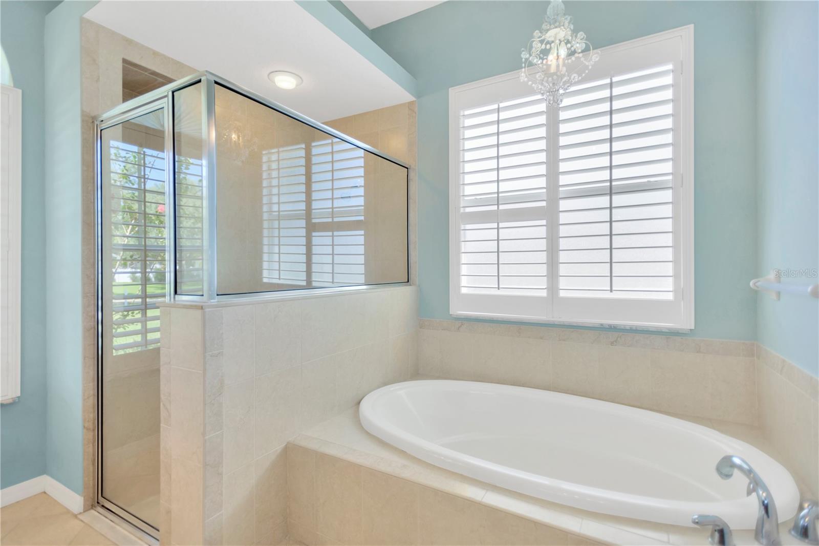 Garden tub with separate shower.  There is a water closet with door for privacy to the right of the tub.