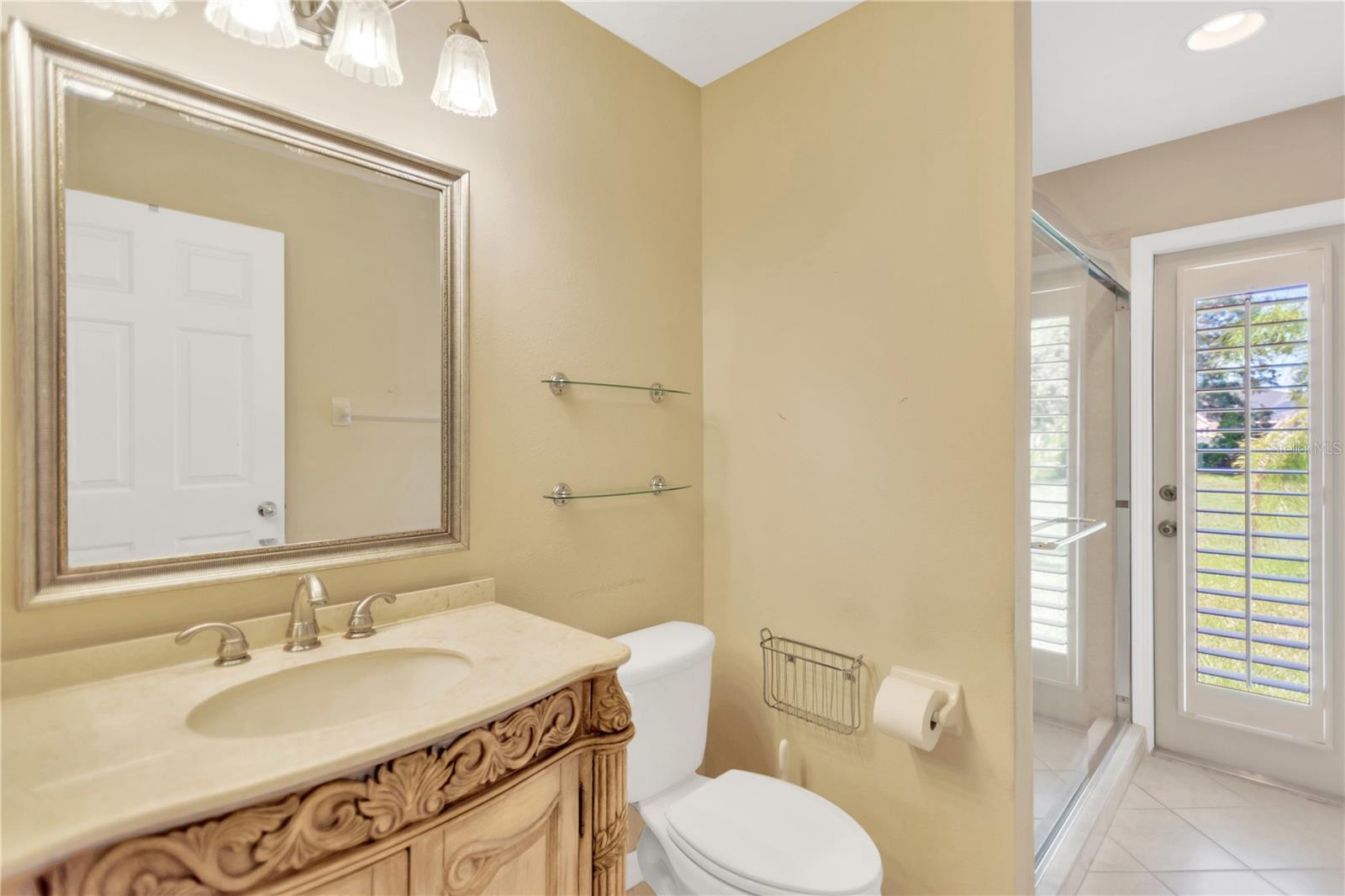 Bath 3 is next to Bedroom 4 and has a door out into the backyard, which would be perfect for a pool bath if you add a pool.