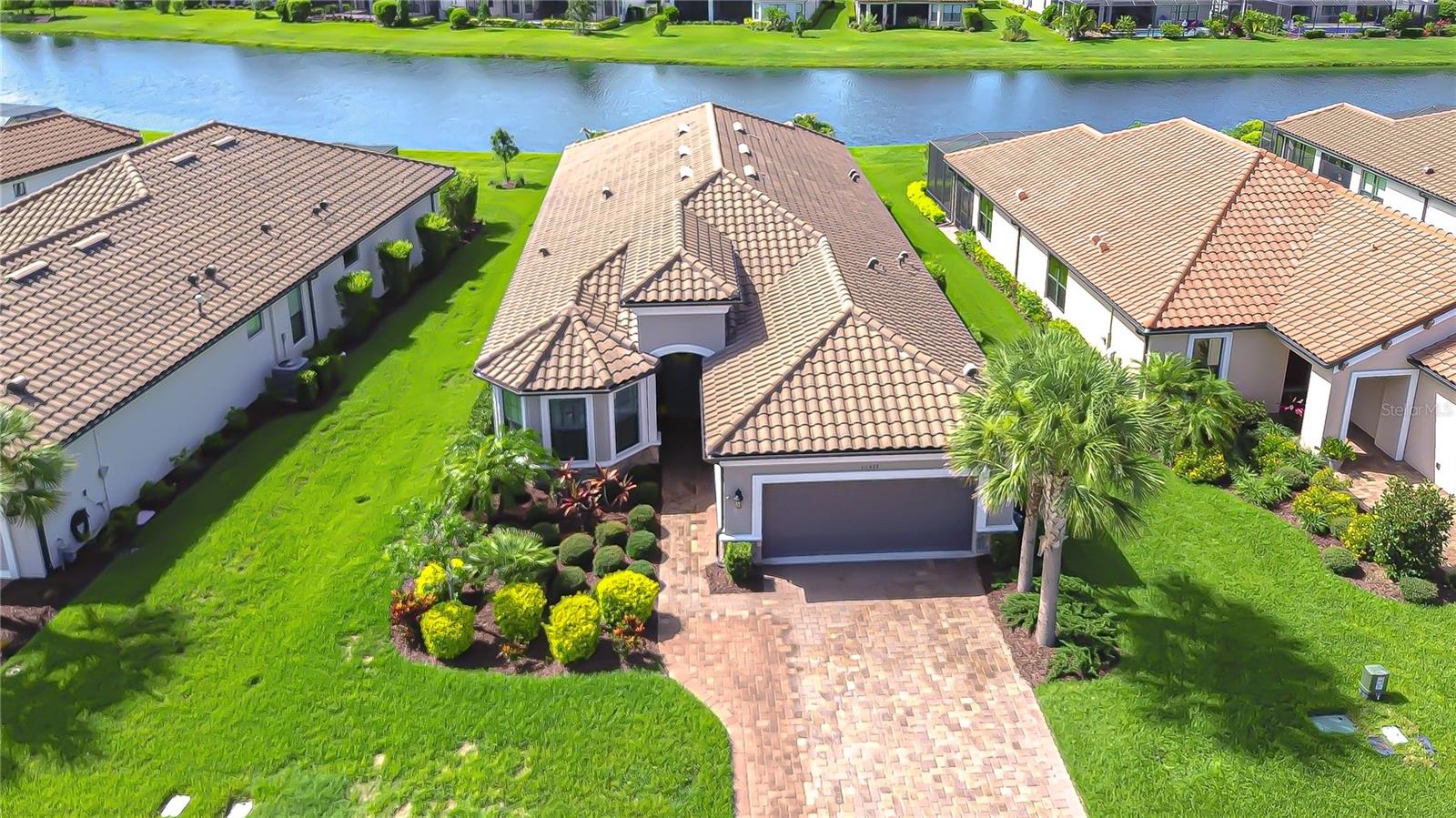 Beautiful curb appeal with brick paver driveway!