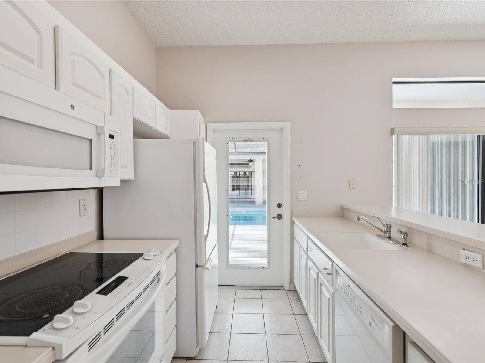 in law kitchen and door to pool deck