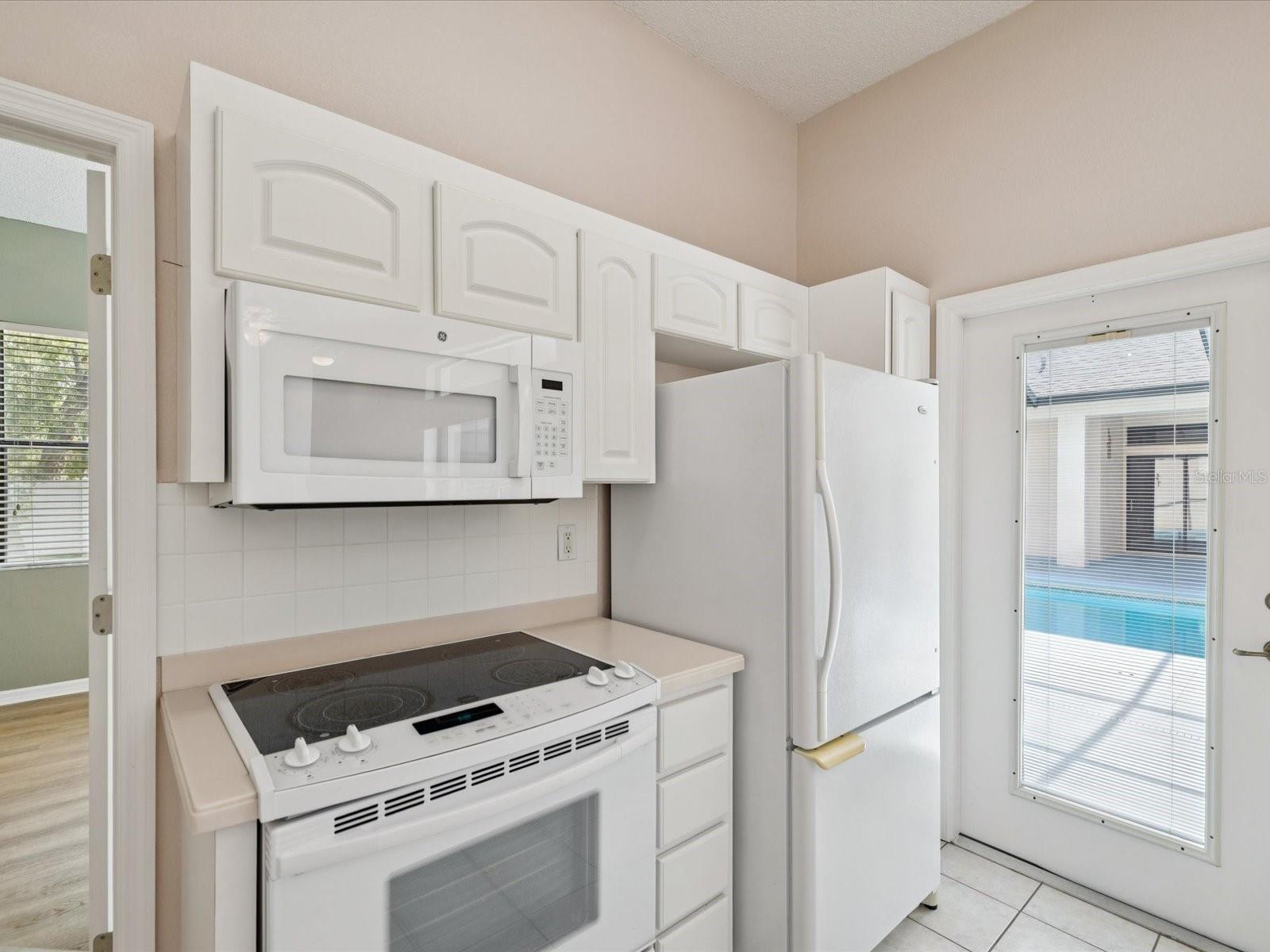 in law kitchen and door to pool deck