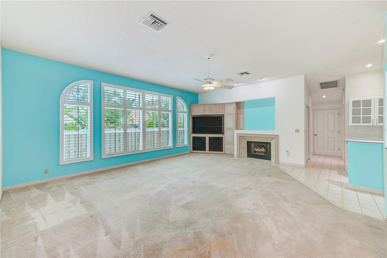 Family room with custom built-in console that pulls out for easy access to back of tv